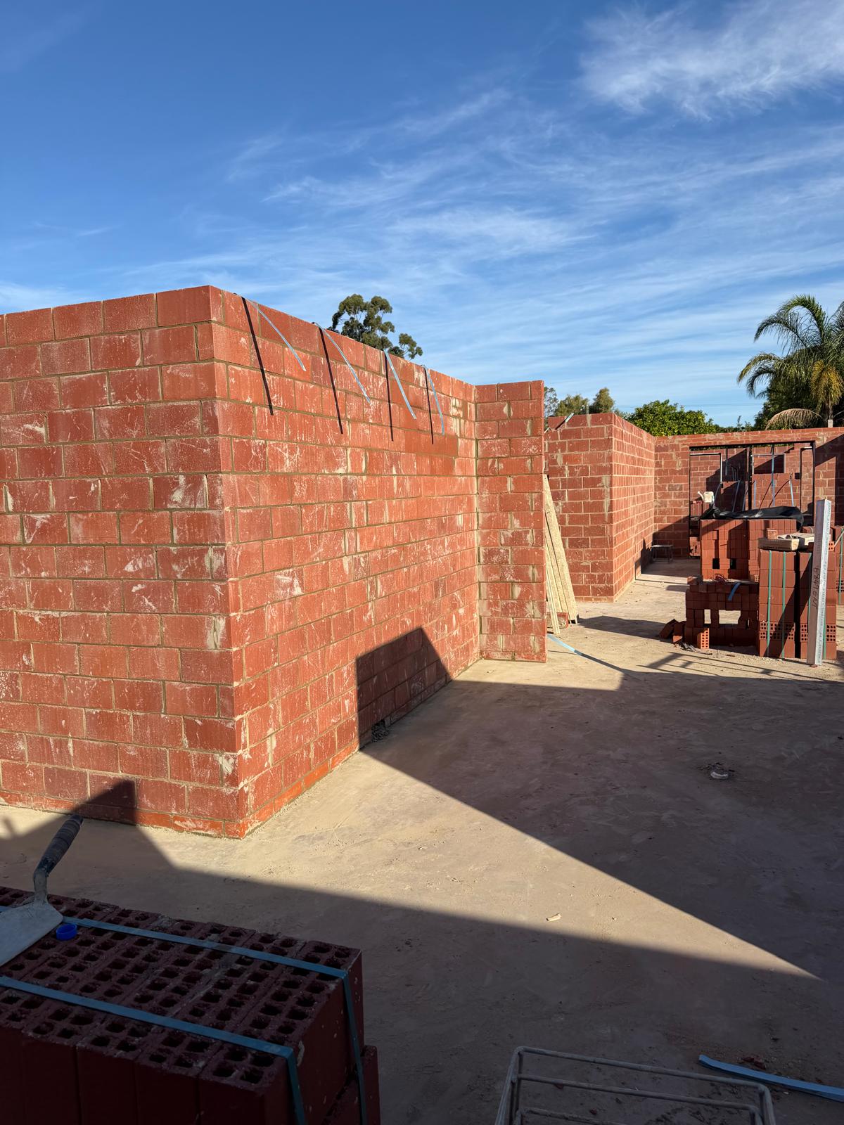 Ground-level view of rendered brick walls during construction at Rhonda Ave Willetton